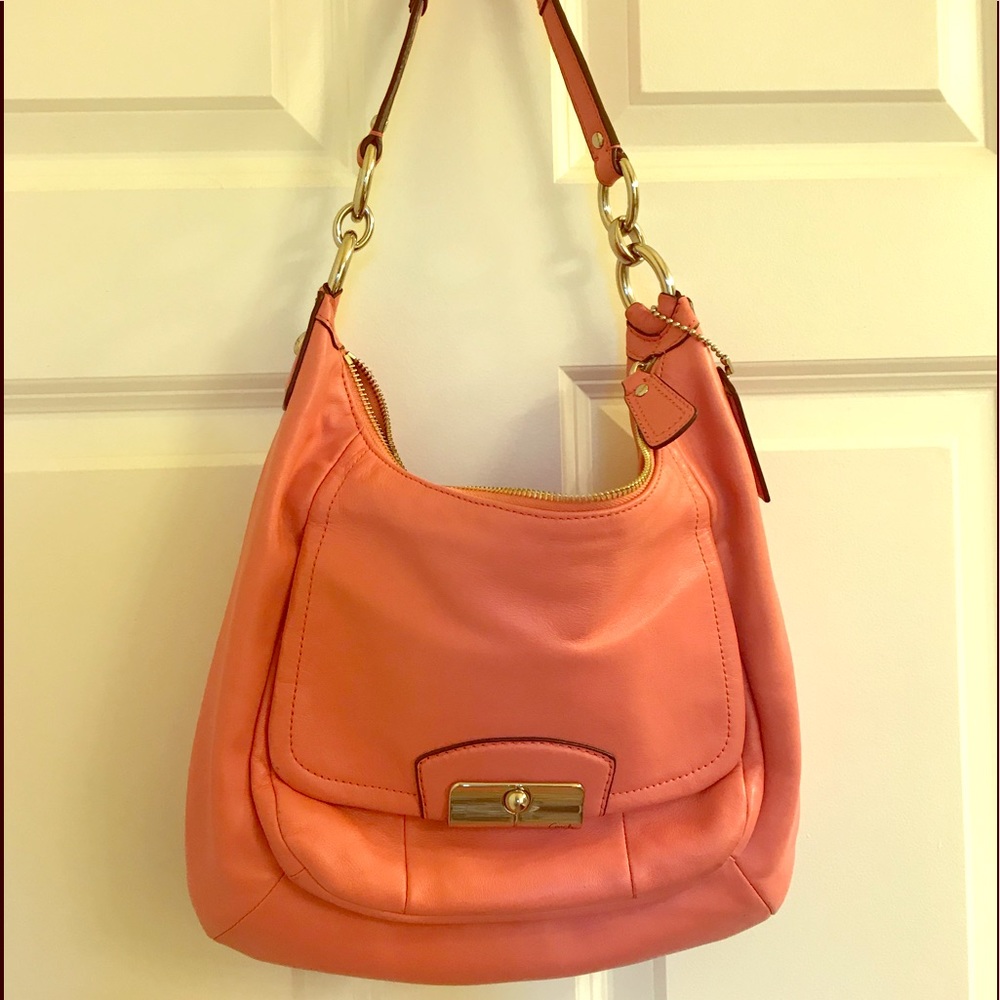 Coach 2 slide pockets inside, 1 zipper pocket